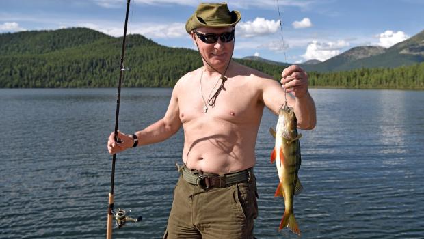 Russian President Vladimir Putin goes bare-chested fishing in